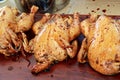 Three whole chickens in marinade