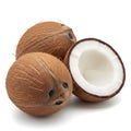 Three whole coconuts and one cut in half on a white background Royalty Free Stock Photo