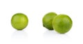 Three whole limes isolated on a white background