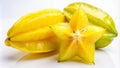 Three whole and one sliced starfruit on a white background Royalty Free Stock Photo