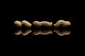 Three whole peanuts isolated on black background Royalty Free Stock Photo