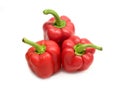 Three whole red ripe bell peppers isolated on white background close up Royalty Free Stock Photo