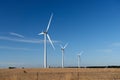Three wind turbines on a farm in an Australian landscape. Royalty Free Stock Photo