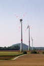Three wind turbines in a hilly landscape Royalty Free Stock Photo