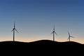 Three wind turbines in the hills of northern California at sunrise Royalty Free Stock Photo