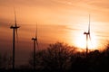 Three wind turbines at sunset Royalty Free Stock Photo