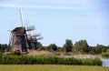 Three windmills in a row at the driemanspolder Royalty Free Stock Photo
