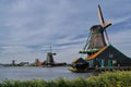 Heritage windmills along the shoreline typify Dutch landscape