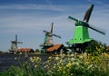 Three windmills and windy weather Royalty Free Stock Photo