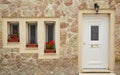 Three windows and a door Royalty Free Stock Photo