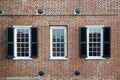 Three windows of an old american building Royalty Free Stock Photo