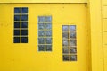 Three windows, yellow wall Royalty Free Stock Photo