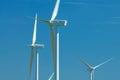 Three windturbines on blue sky Royalty Free Stock Photo