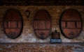 Three wine barrels in an exterior wall Royalty Free Stock Photo
