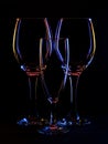 Three wine type glasses, backlit still life with copyspace.