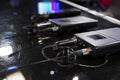 Three wireless microphone transmitter and three wireless microphone reciever on black table in tv studio Royalty Free Stock Photo