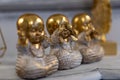 Three Wise little Buddha figurine in a row, Hear no evil, See no evil, Speak no evil Royalty Free Stock Photo