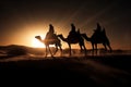 The three wise men on their camels traveling through the desert with the sun reflecting behind their shadows Royalty Free Stock Photo