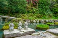 Three wise monkeys. Hear no evil, see no evil, speak no evil in a Japanese garden, Japan. Royalty Free Stock Photo