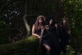 Three witches in dark forest