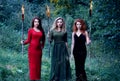 Three witches with with torches