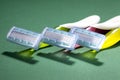 Three women colorful razors with selective focus on a green background. Royalty Free Stock Photo