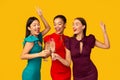 Three Women In Dresses Clinking Glasses Celebrating Bachelorette, Studio Shot Royalty Free Stock Photo