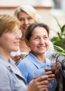 Three women drinking tea at balcony Royalty Free Stock Photo