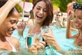 Three Women Having Party In Swimming Pool Drinking Champagne Royalty Free Stock Photo