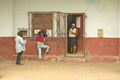 Three women near old building in village near El Rincon, Cuba