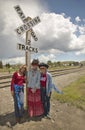 Three women at a railroad crossing dressed for the Fourth of July,in Lima Montana