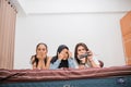 three women are scared when watching horror movies on the bed Royalty Free Stock Photo