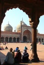 Three women sitting in front of Jama Masjid/Mosque Royalty Free Stock Photo