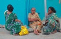 Three women are sitting outdoor in Kanyakumari, India Royalty Free Stock Photo