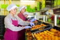 Three women sorting peaches Royalty Free Stock Photo