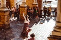 Three women in traditional costumes dance spanish flamenco on the plaza de Espana on February 2019 in Seville Royalty Free Stock Photo