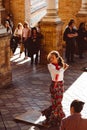 Three women in traditional costumes dance spanish flamenco on the plaza de Espana on February 2019 in Seville Royalty Free Stock Photo