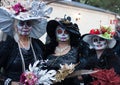 SAN ANTONIO, TEXAS - OCTOBER 28, 2017 - Three women wearing fancy hats and face paint for Dia de Los Muertos/Day of the Dead celeb Royalty Free Stock Photo