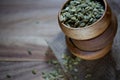 Three wood bowls stacked with pumpkin seeds on wood board Royalty Free Stock Photo