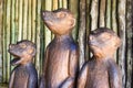 Three Wood Meerkats on the lookout, Decorative Royalty Free Stock Photo
