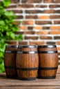 Three wooden barrels sitting on top of a wooden table Royalty Free Stock Photo