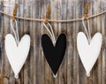 Three wooden black and white heart hang Royalty Free Stock Photo