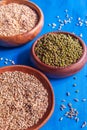 Three wooden bowls with germination seeds and pearl grits Royalty Free Stock Photo