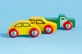 Three wooden cars toys on azure background Royalty Free Stock Photo