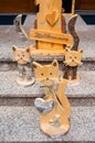 Three wooden cats and german welcome sign