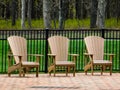 Three Wooden Chairs By A Fence Royalty Free Stock Photo