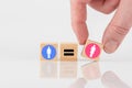 Wooden cubes showing the equality between two genders on a white background