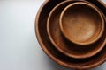 Three wooden empty food bowls stacked on top of each other Royalty Free Stock Photo