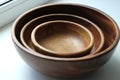 Three wooden empty food bowls stacked on top of each other Royalty Free Stock Photo