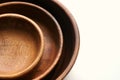 Three wooden empty food bowls stacked on top of each other Royalty Free Stock Photo